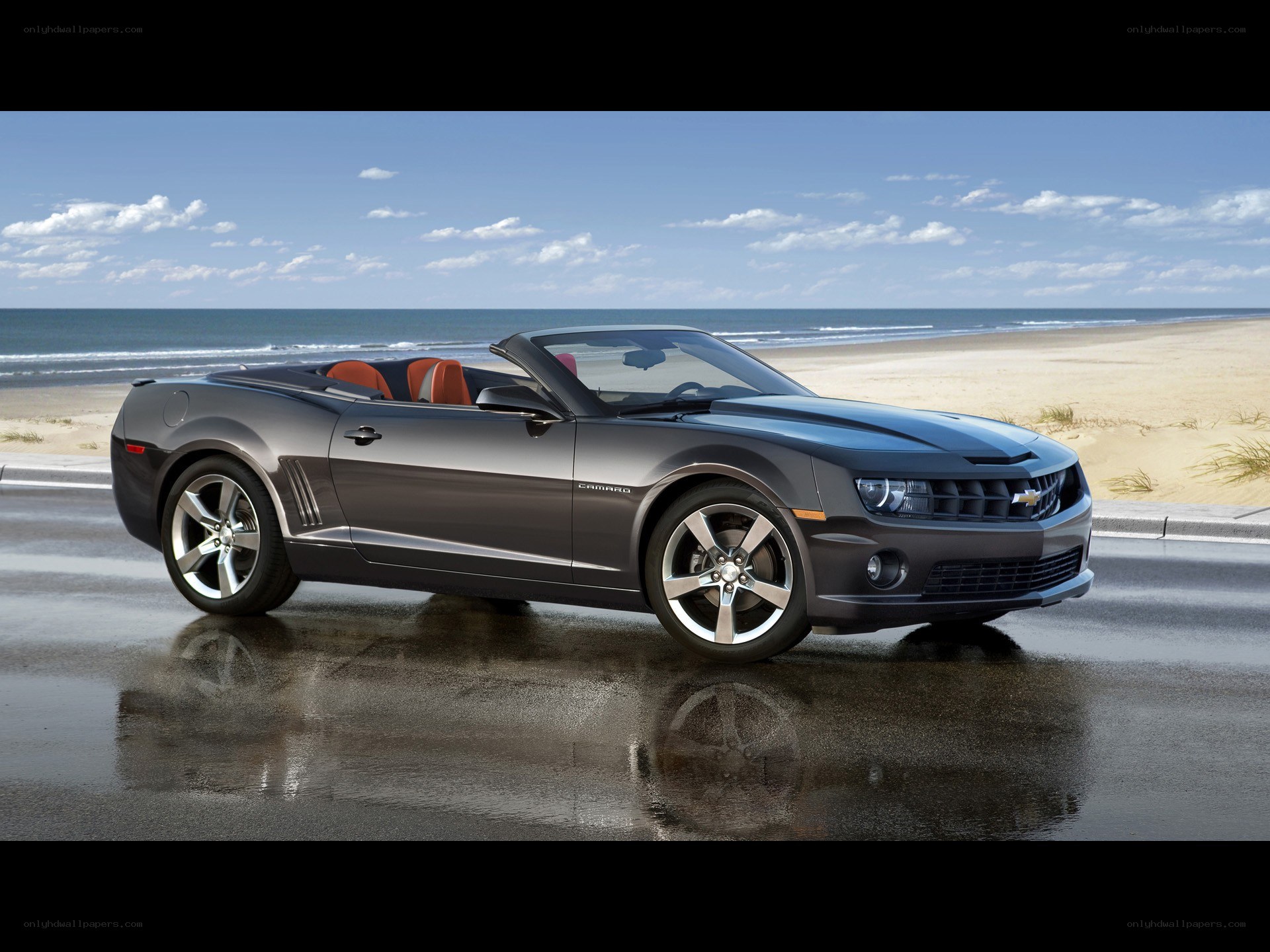 Gray Camaro convertible on beach