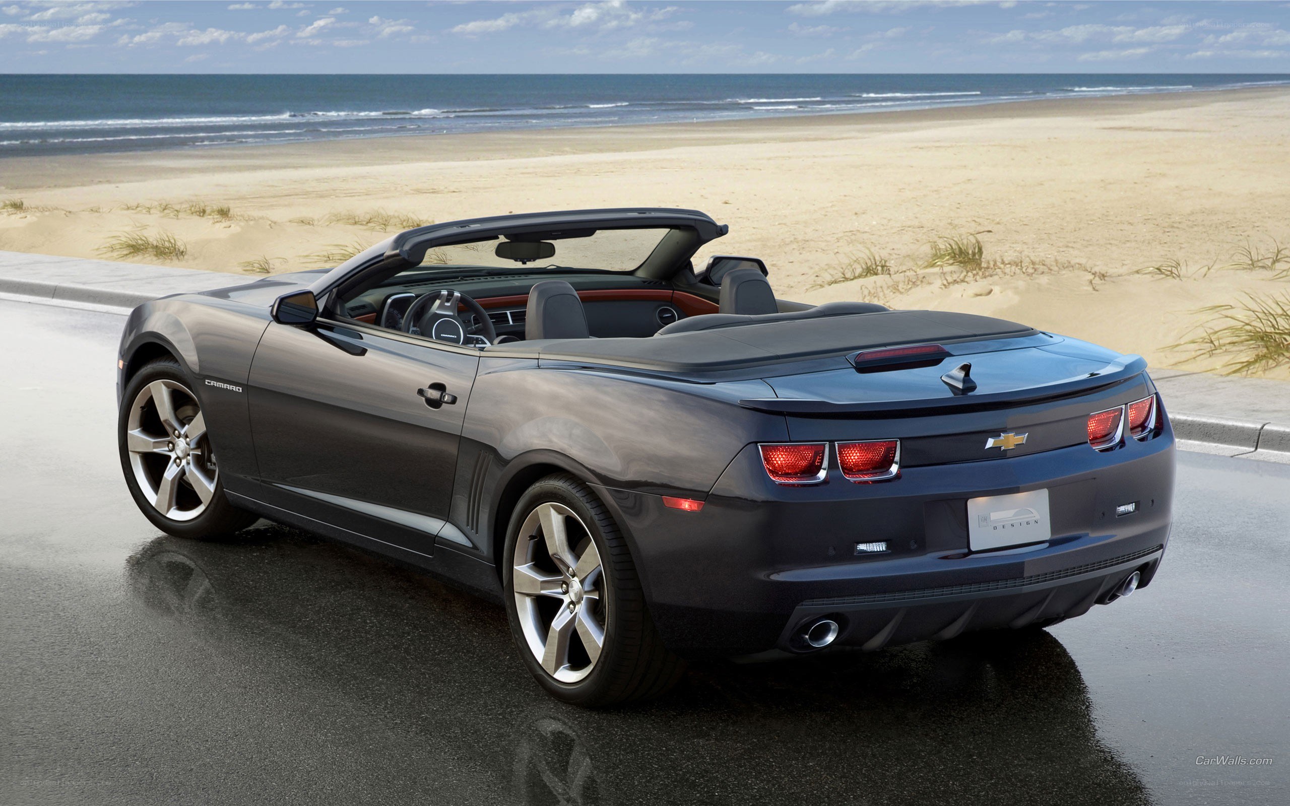 Gray Camaro convertible on beach