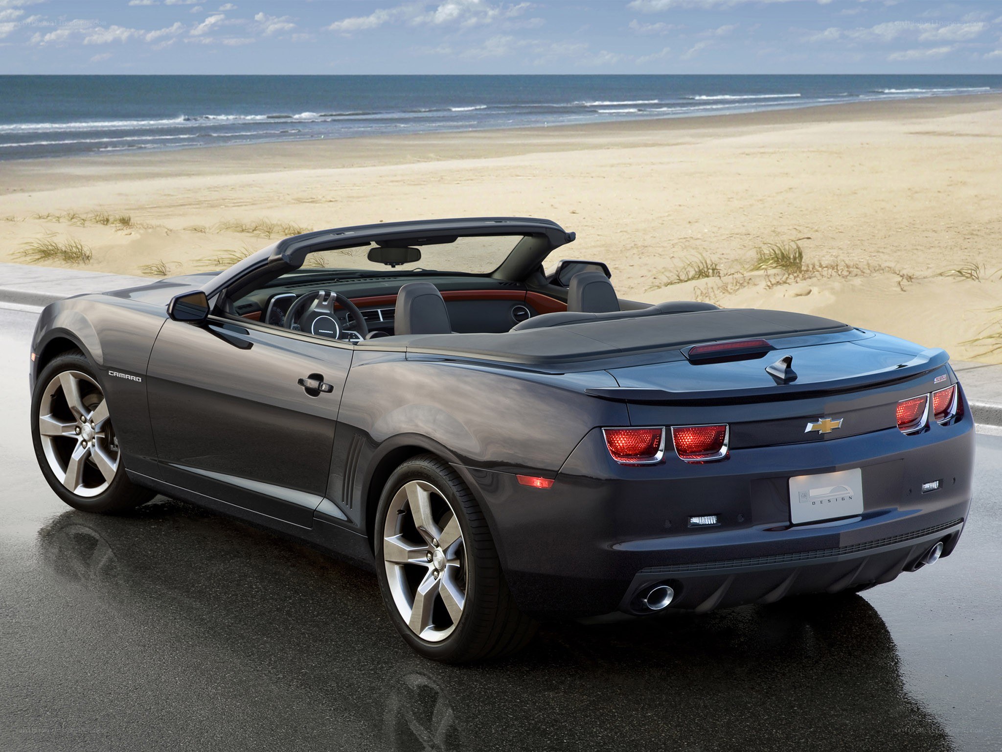 Gray Camaro convertible on beach