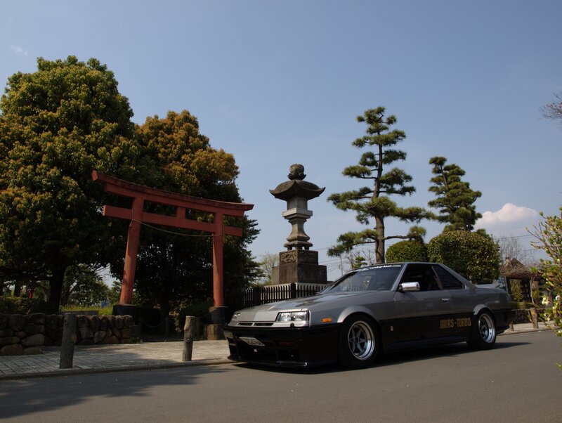 Gray car at a shrine