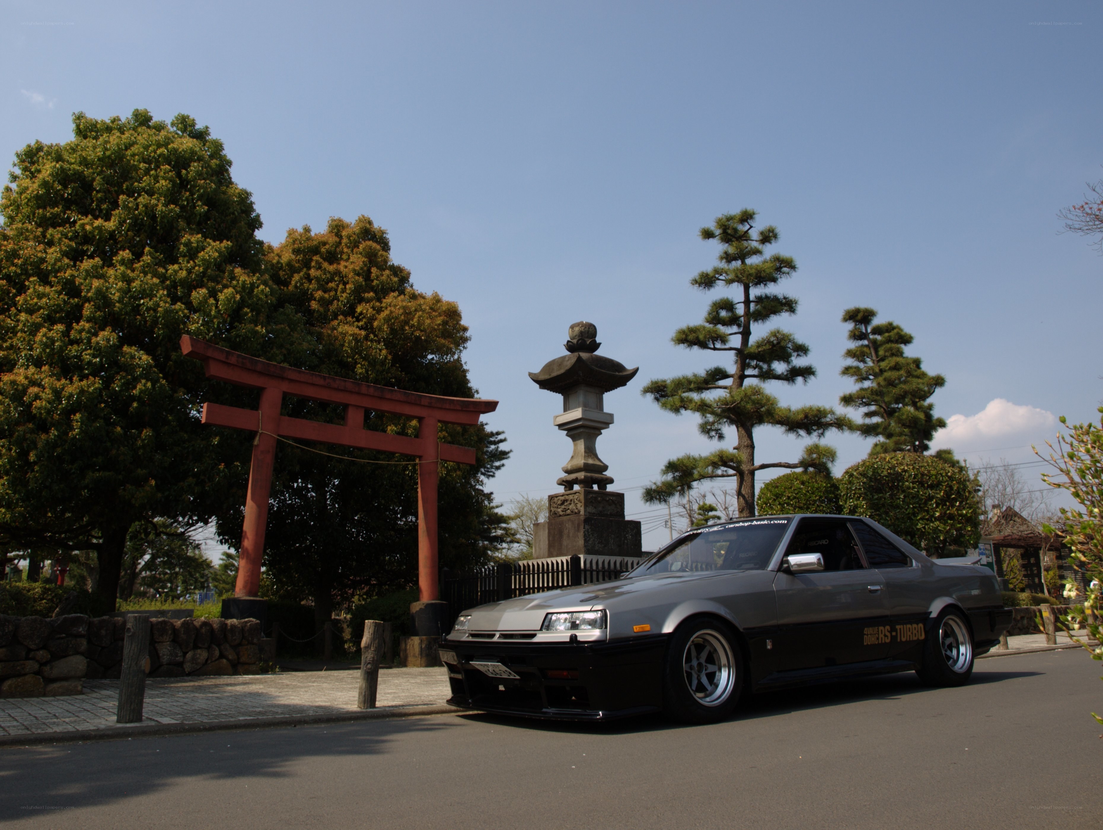 Gray car at a shrine