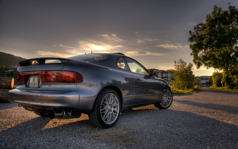 Gray car at sunset