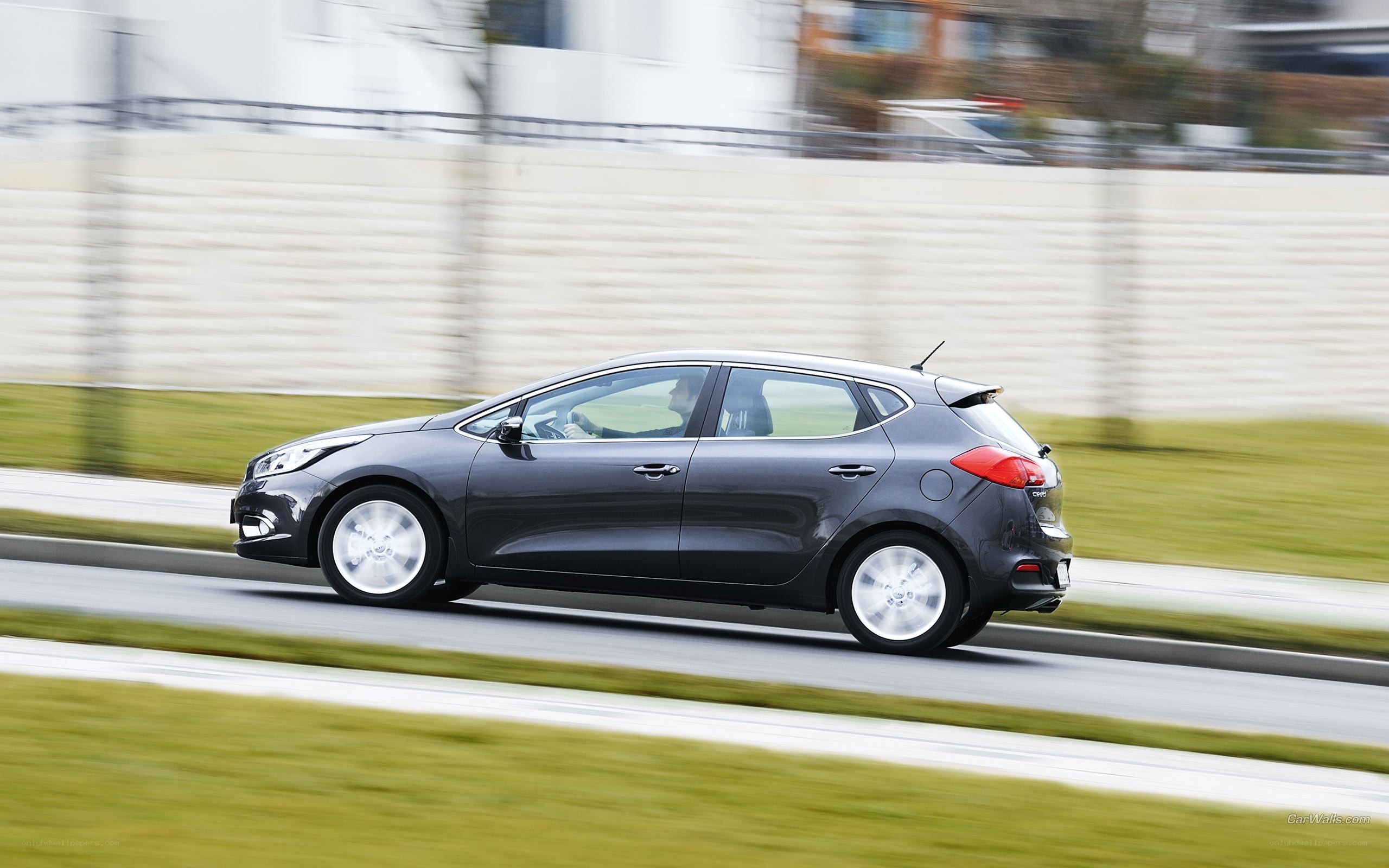 gray car driving on road