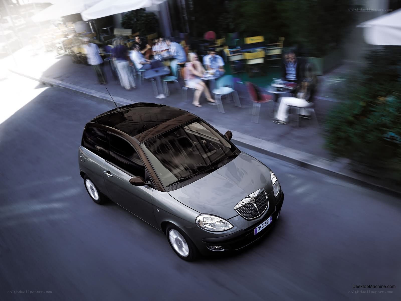 Gray car driving on street