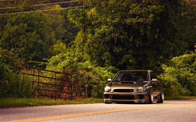 gray car on rural road