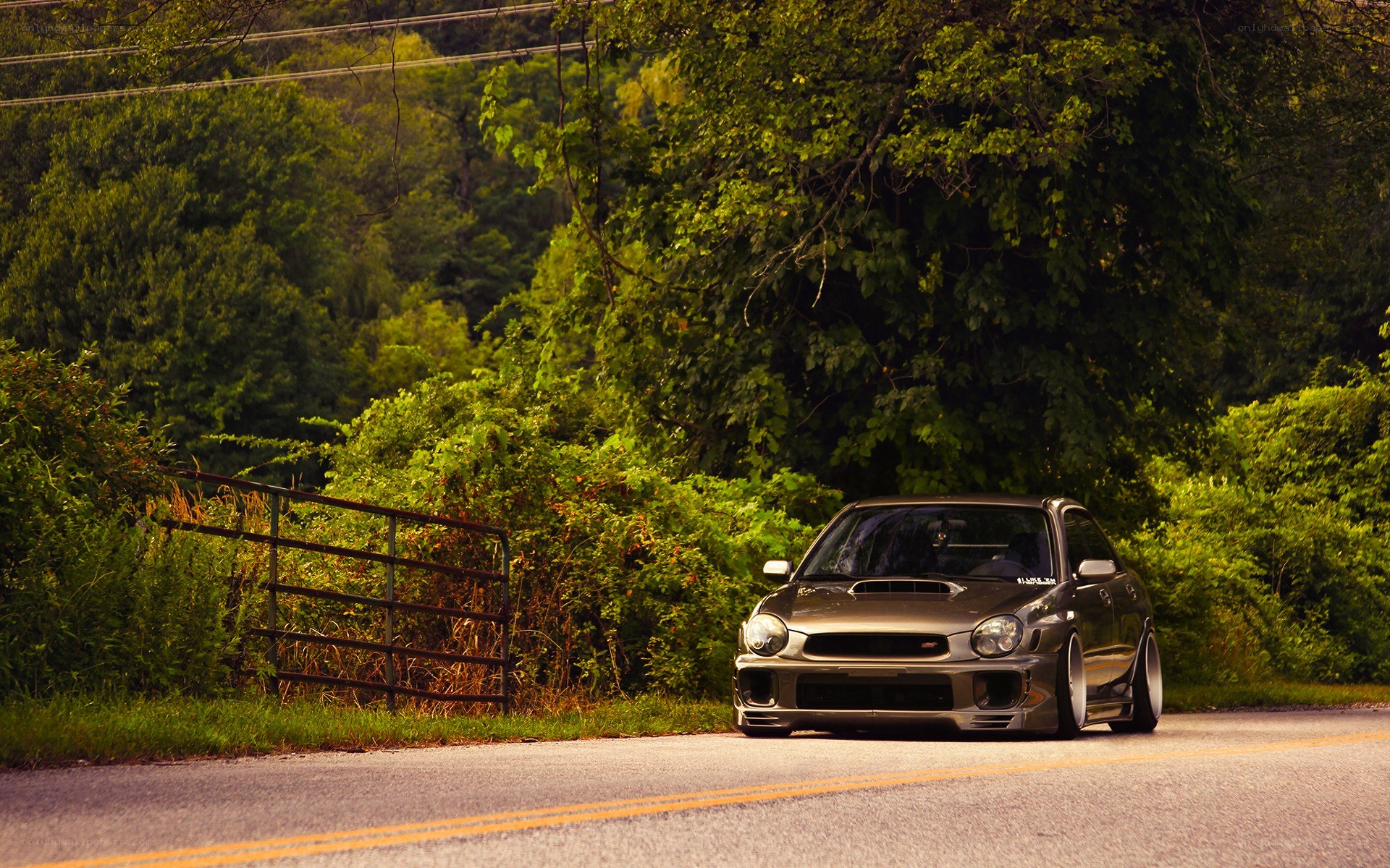 gray car on rural road