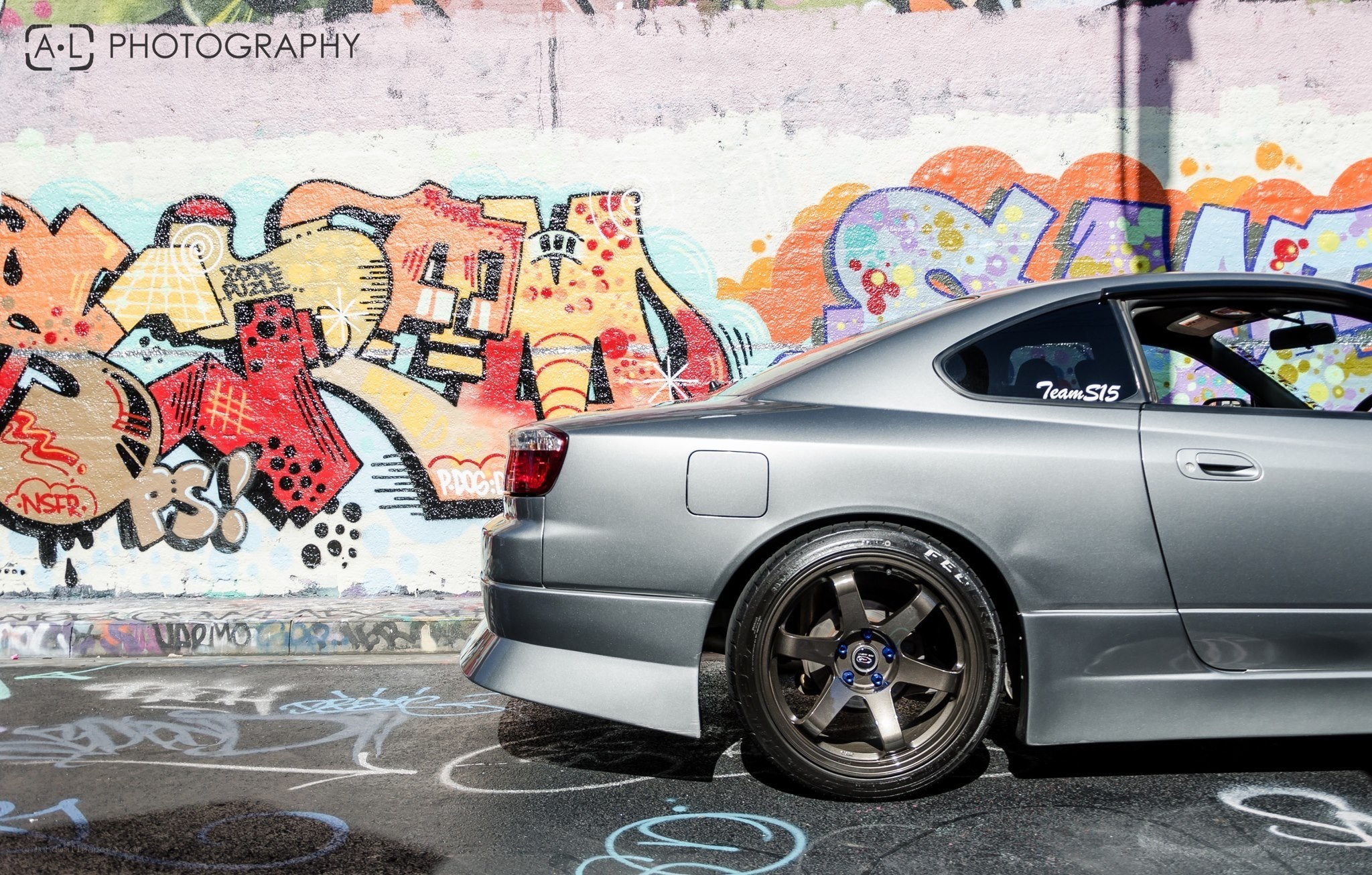 gray car with graffiti art