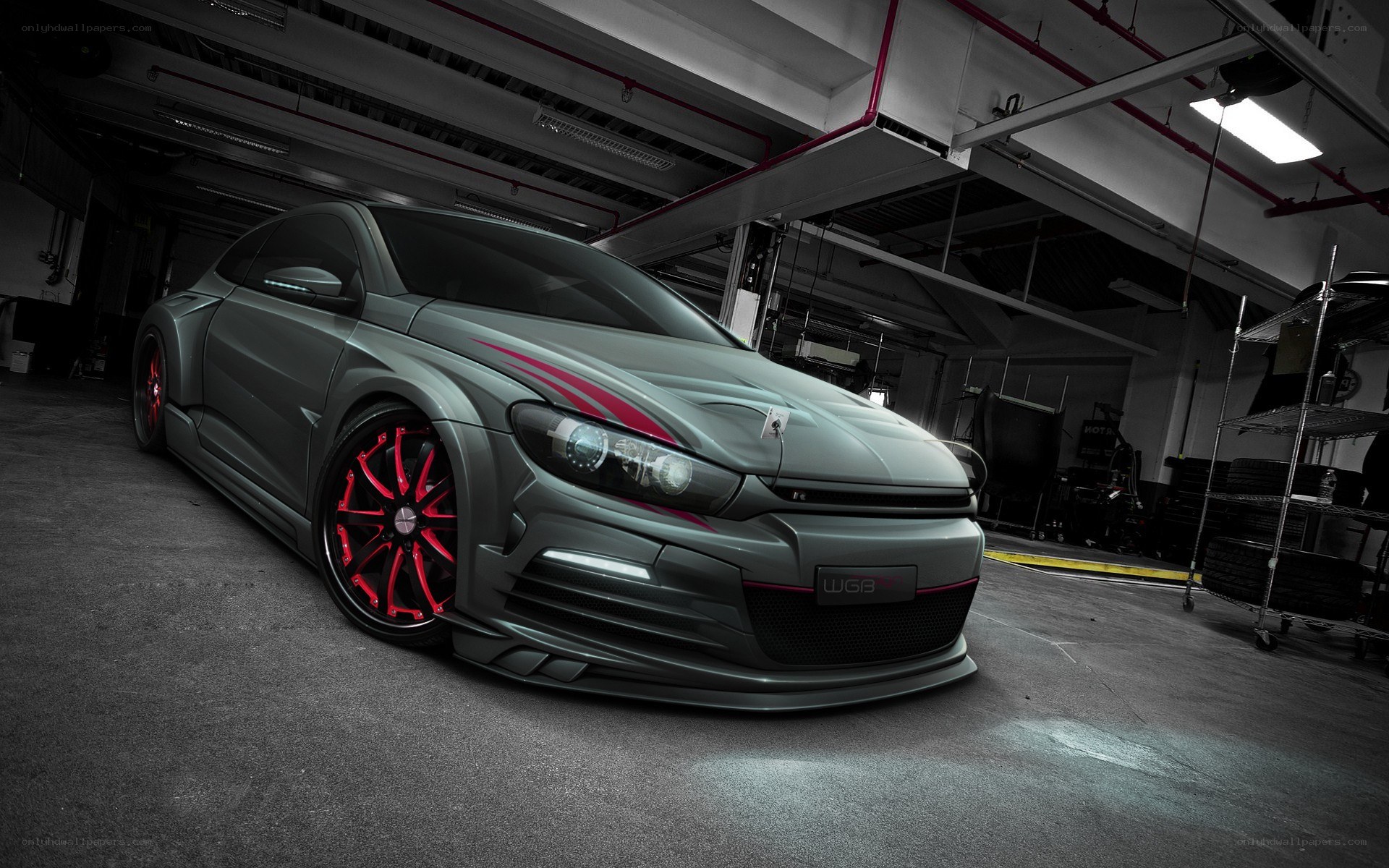 gray car with red wheels