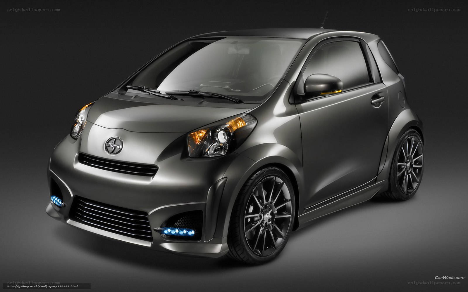 gray compact car with blue lights