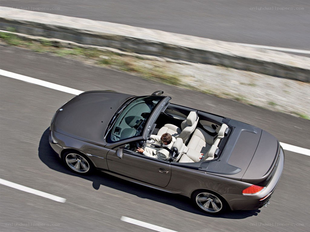 gray convertible driving on highway