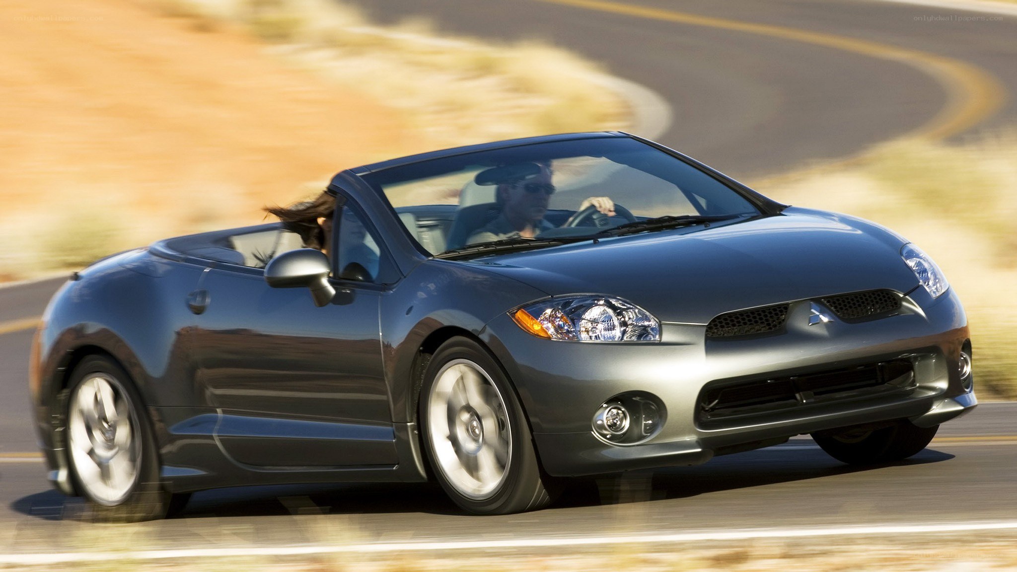 gray convertible driving on road