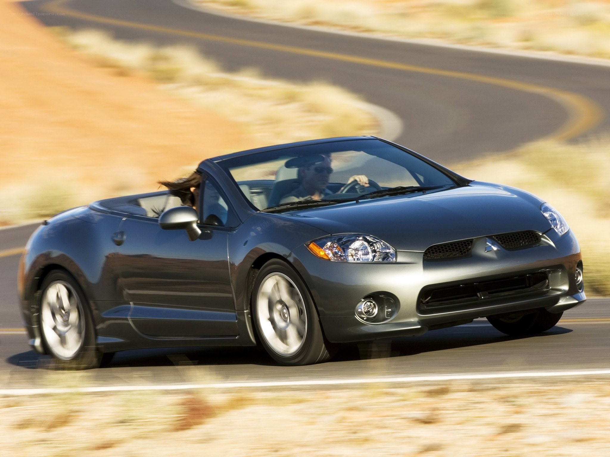 gray convertible driving on road