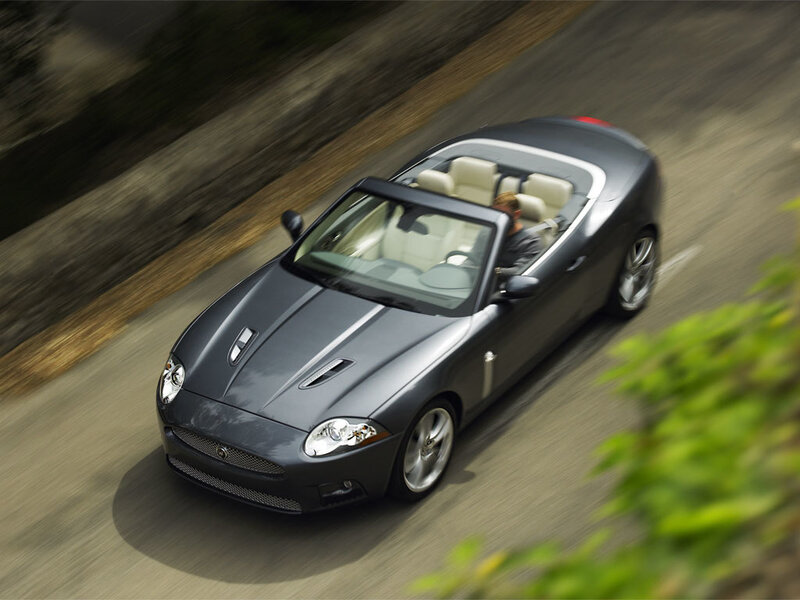 Gray convertible sports car in motion