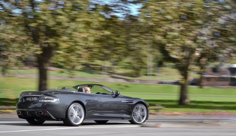 Gray convertible sports car in motion