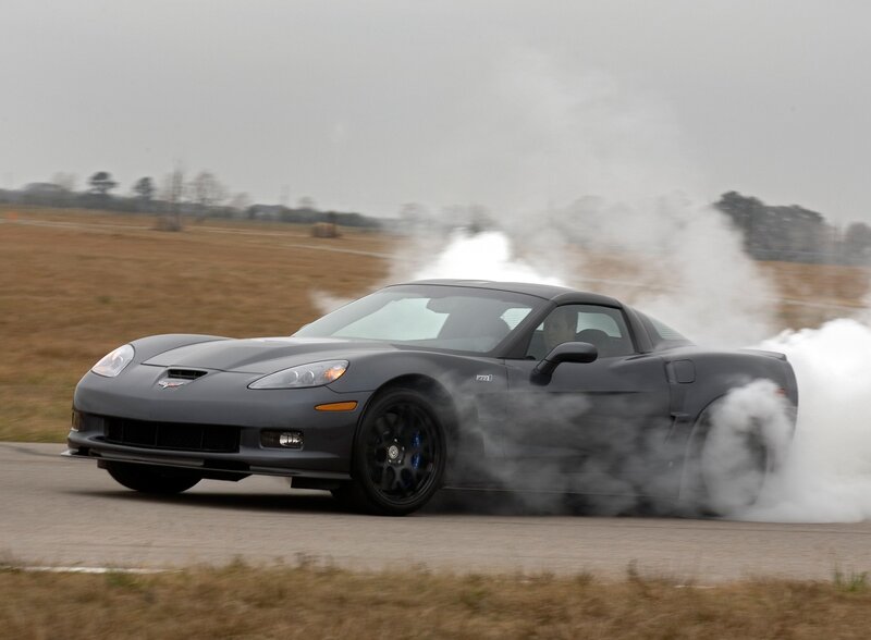 gray corvette doing burnout