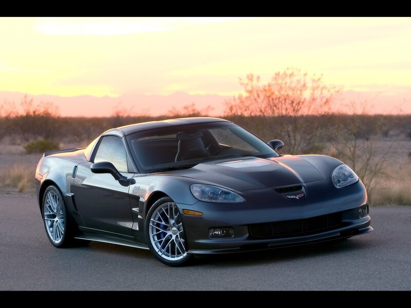 Gray Corvette in desert sunset