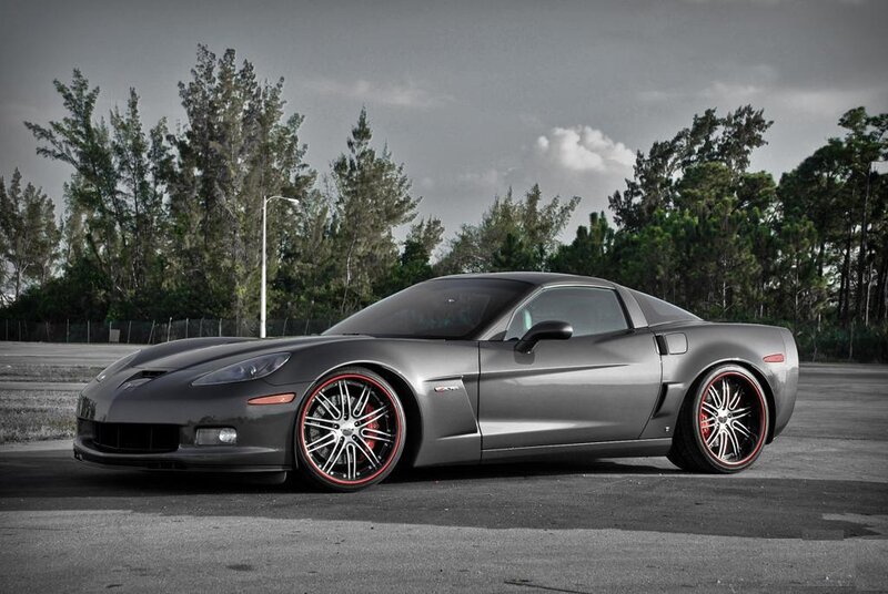 gray corvette with red rims