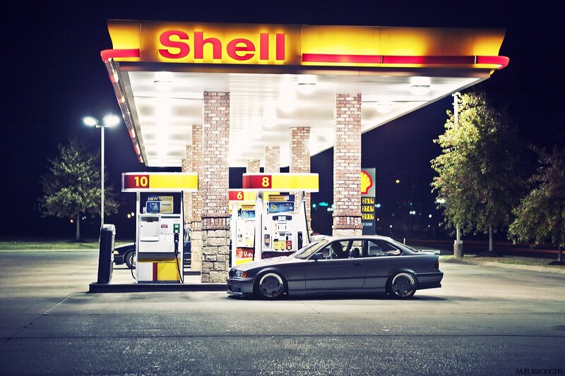 Gray Coupe at Gas Station