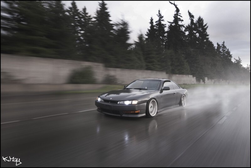 gray coupe drifting in rain