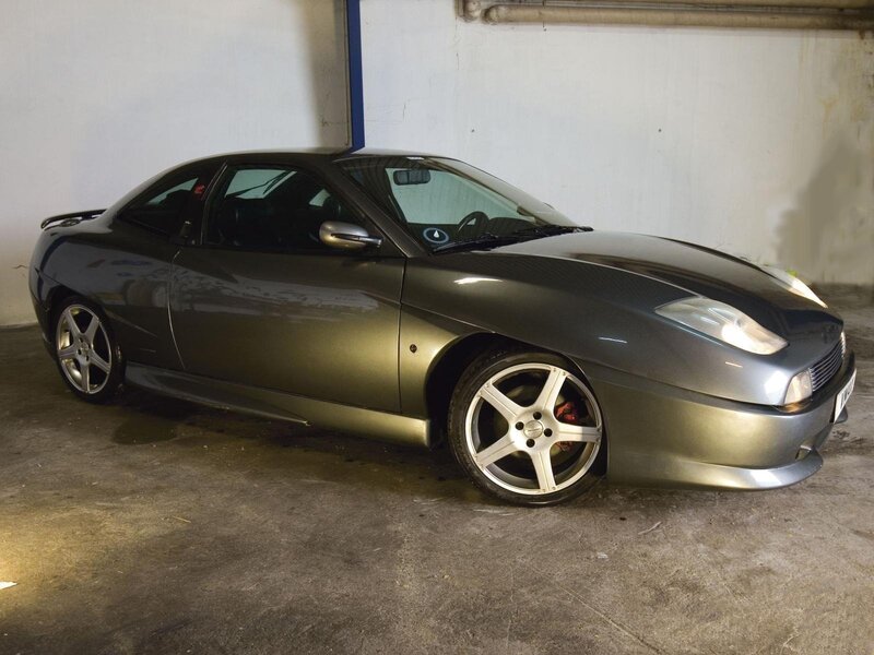 gray coupe in garage