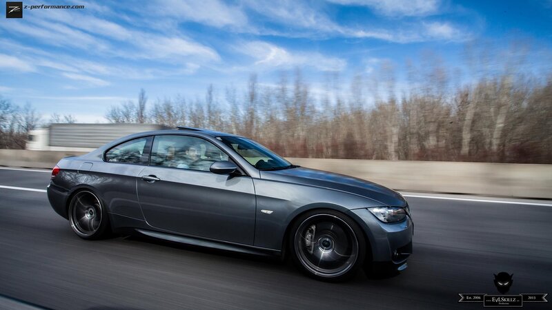 gray coupe in motion
