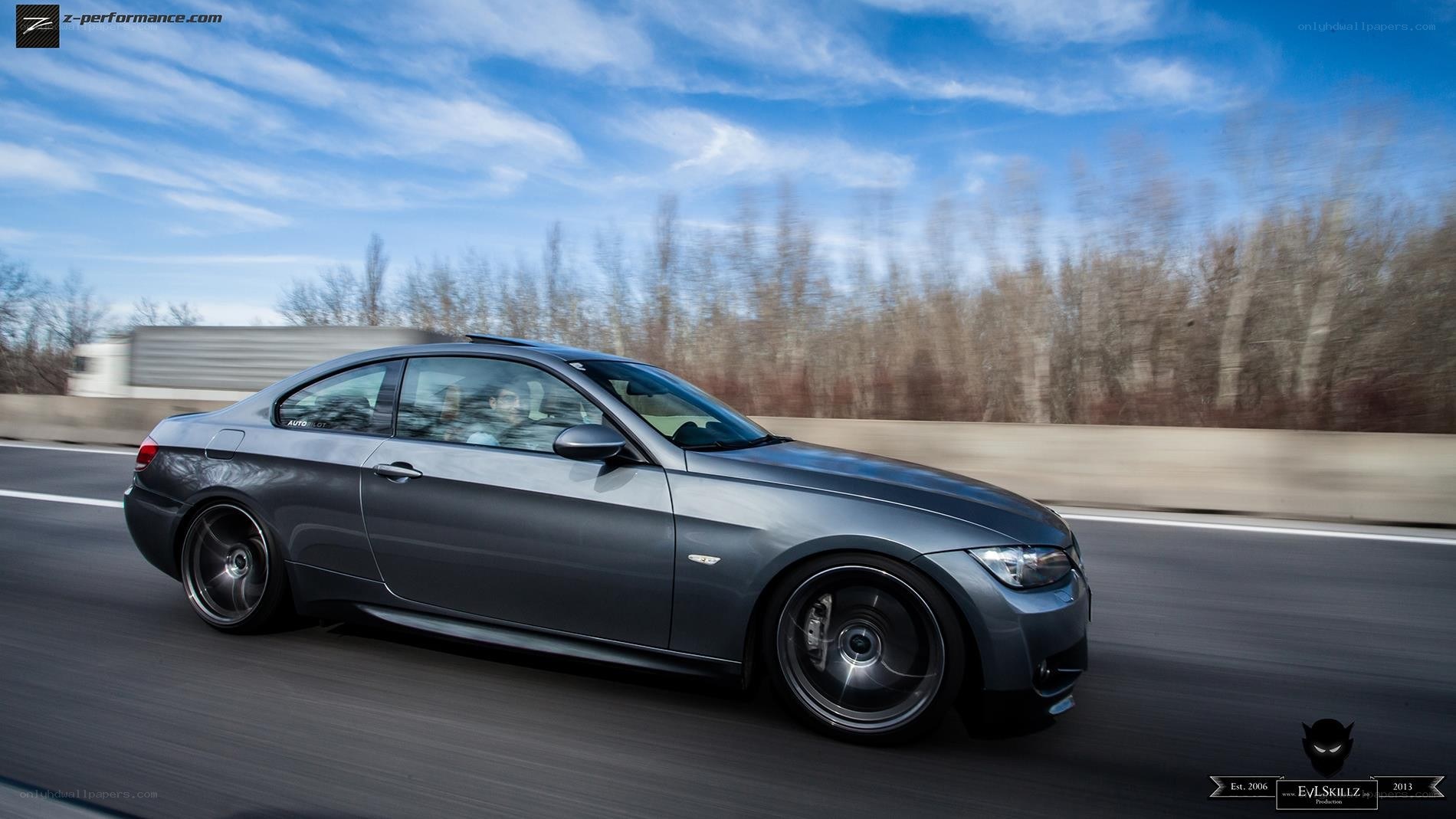 gray coupe in motion