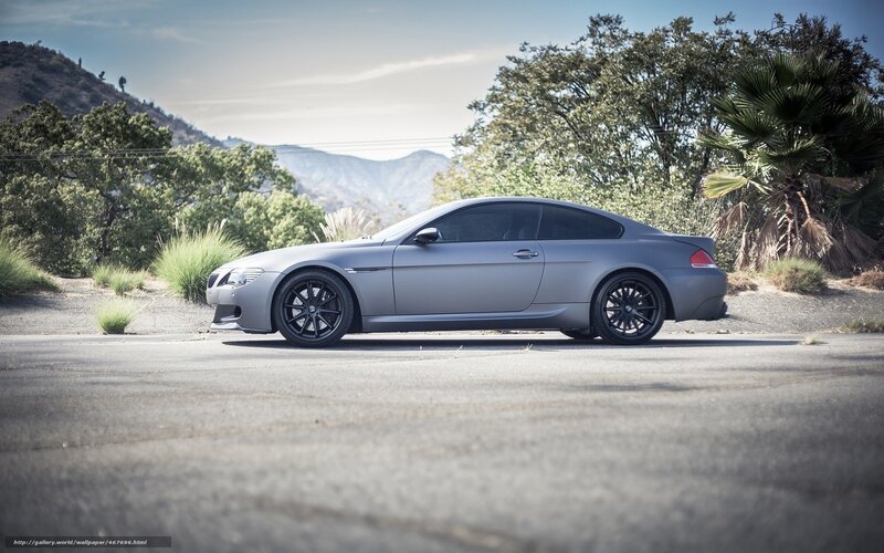 gray coupe on a mountain road