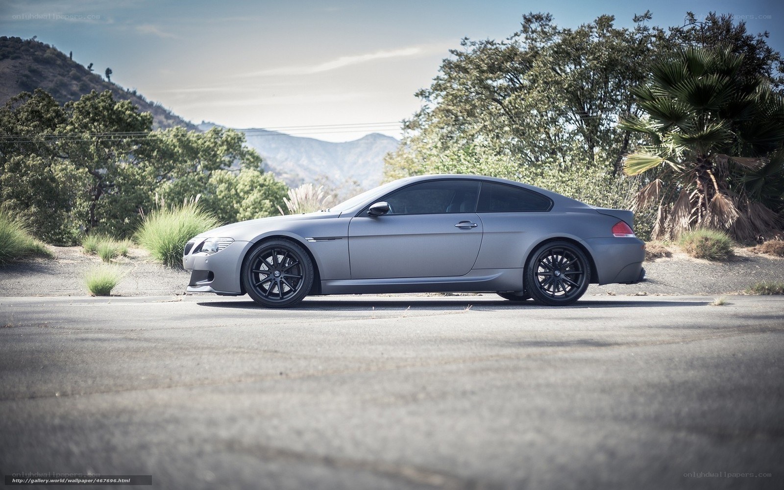 gray coupe on a mountain road