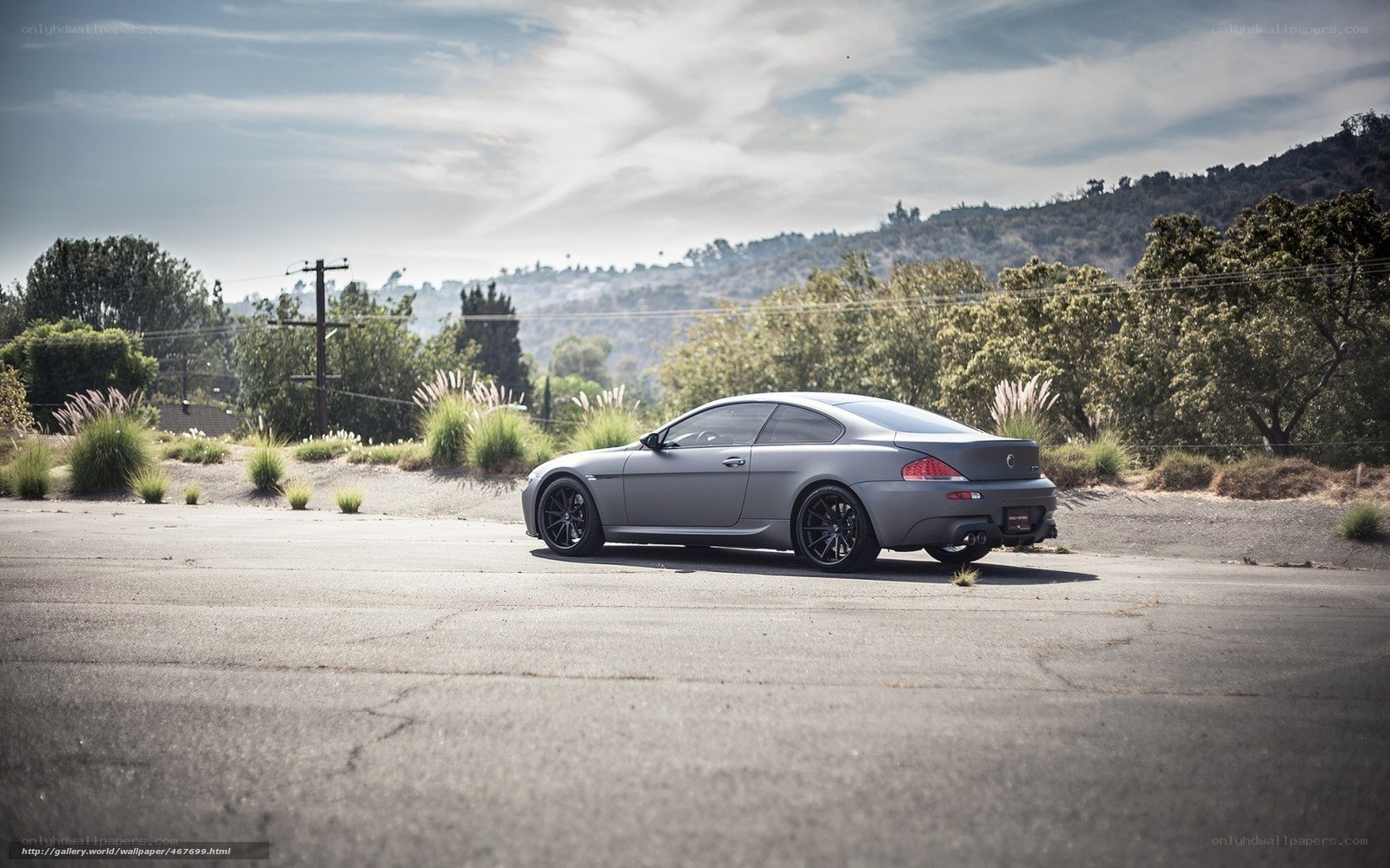gray coupe on asphalt road