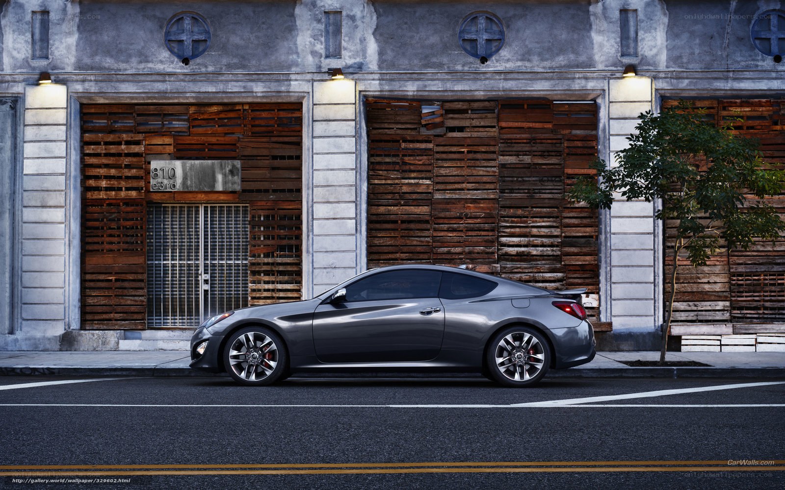 gray coupe on city street