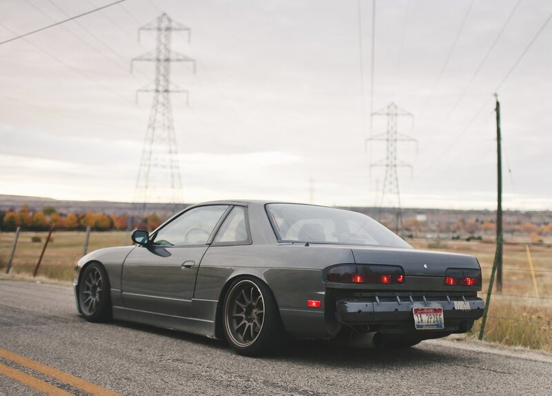 gray coupe on rural road