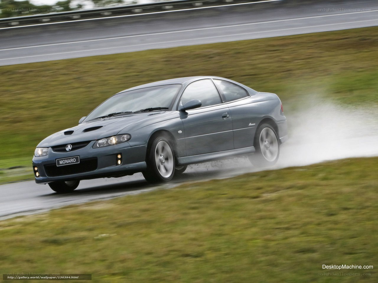 gray coupe on wet track