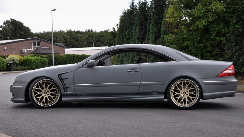 gray coupe with gold wheels