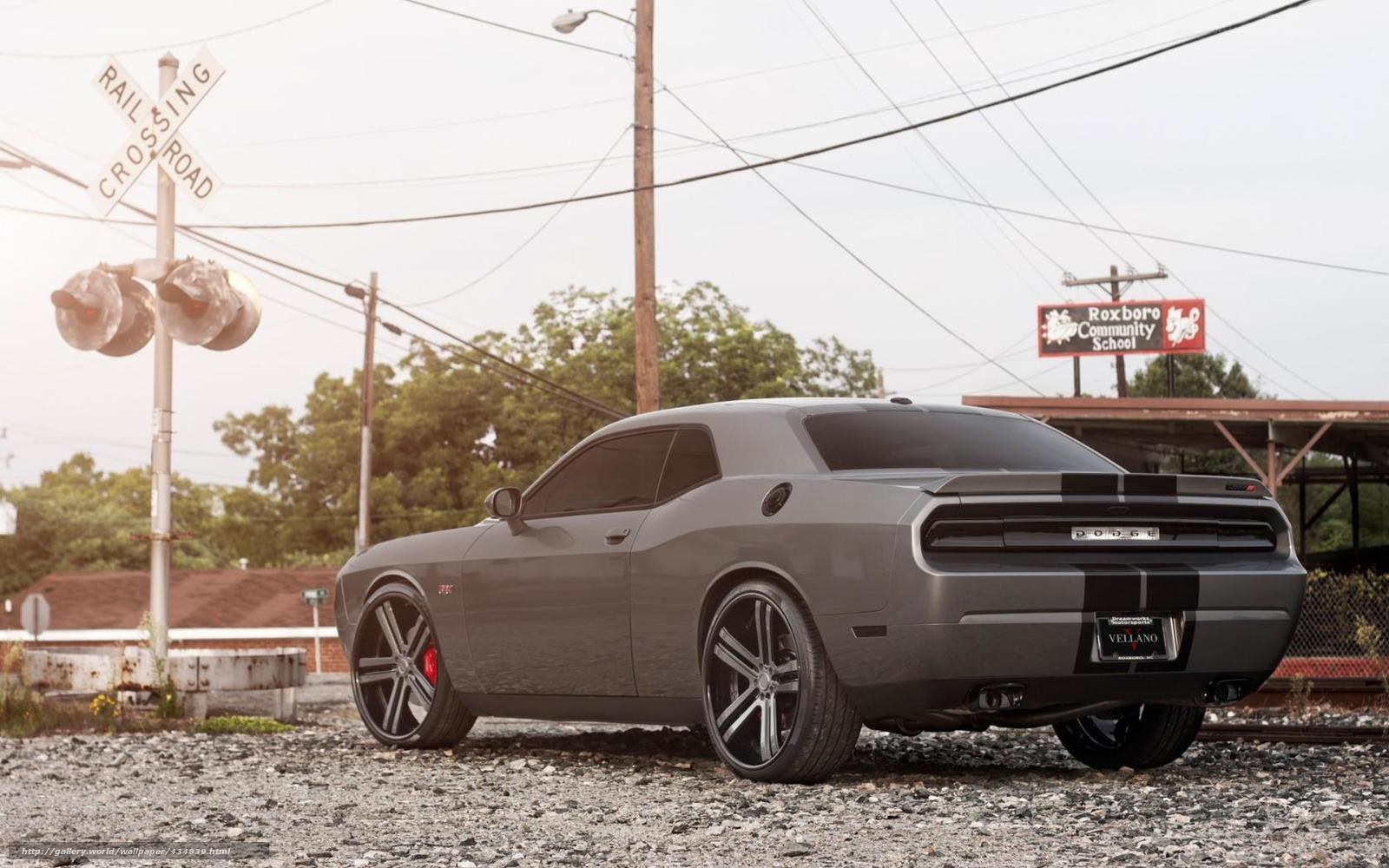 Gray Dodge Challenger at railroad crossing
