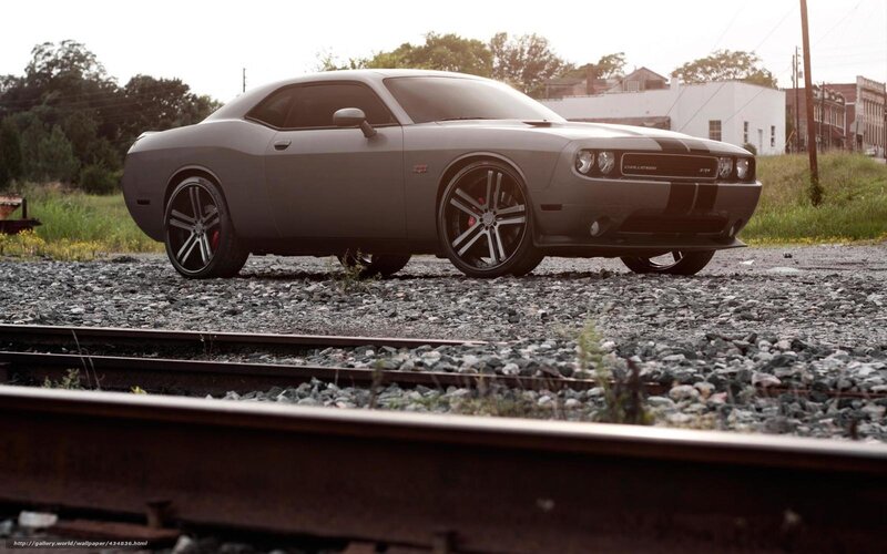 gray dodge challenger on tracks