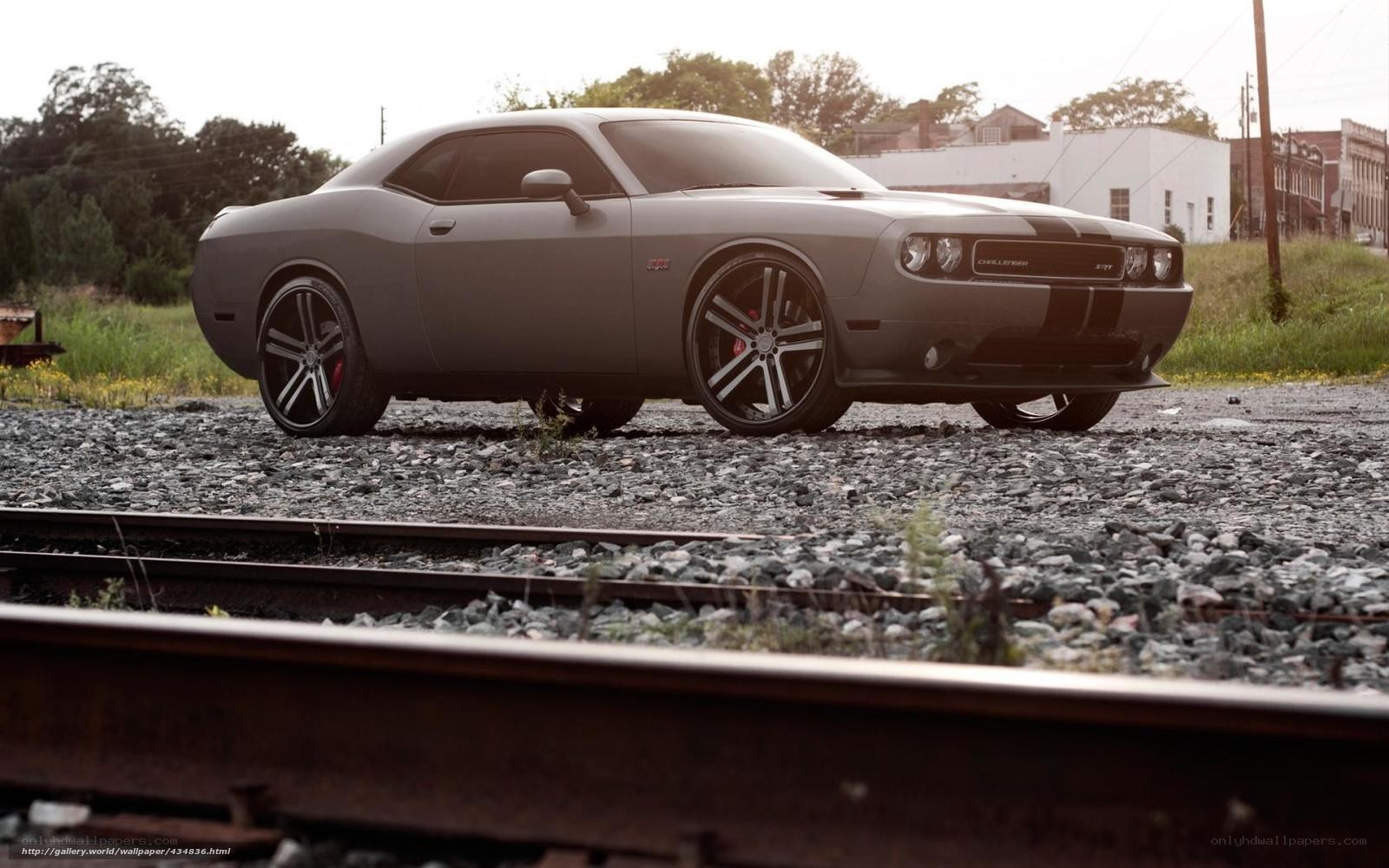 gray dodge challenger on tracks