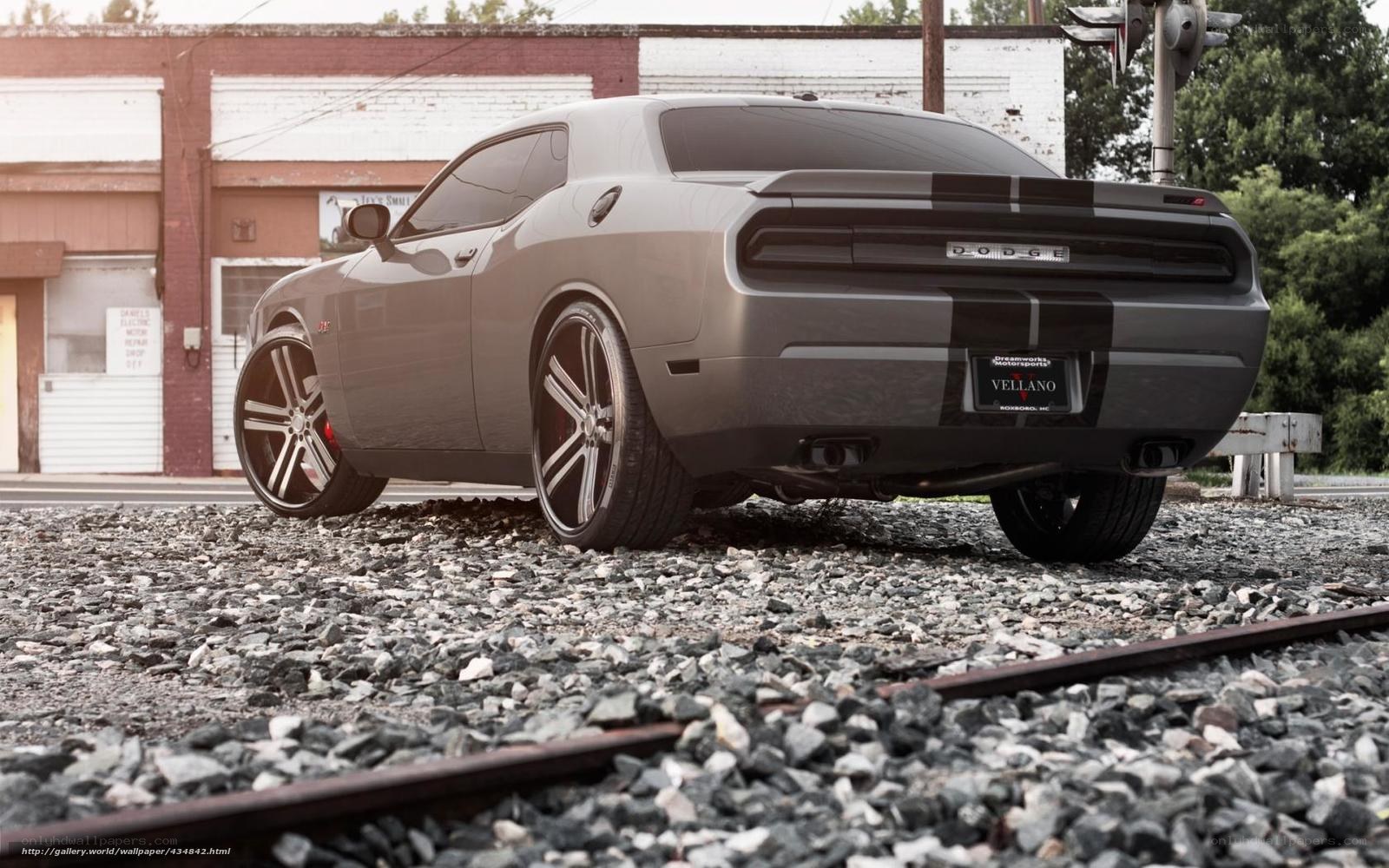 Gray Dodge Challenger on train tracks