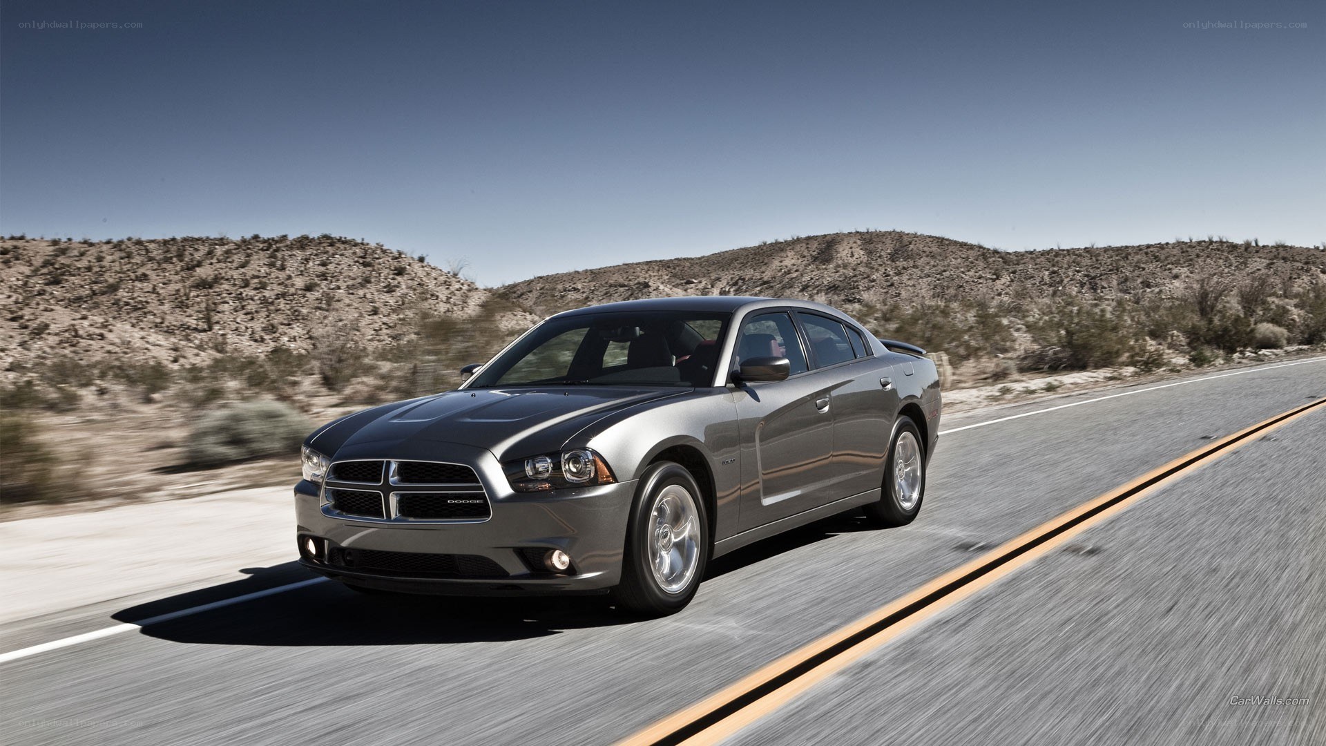 gray dodge charger on desert road