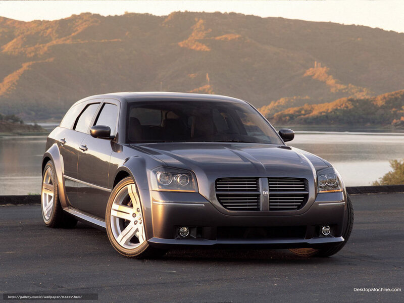 gray dodge sedan by lake