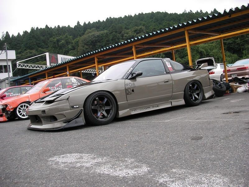 gray drift car at a parking lot