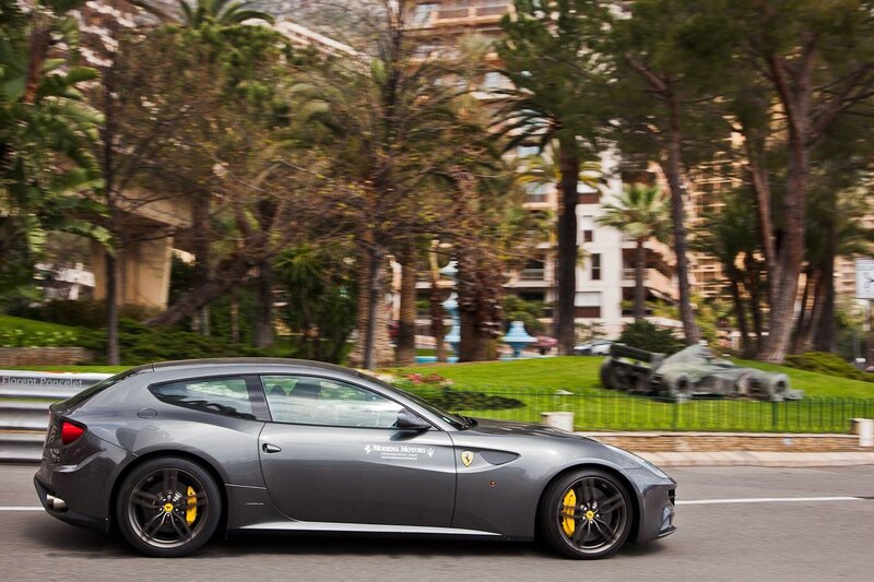 Gray Ferrari driving on a city street