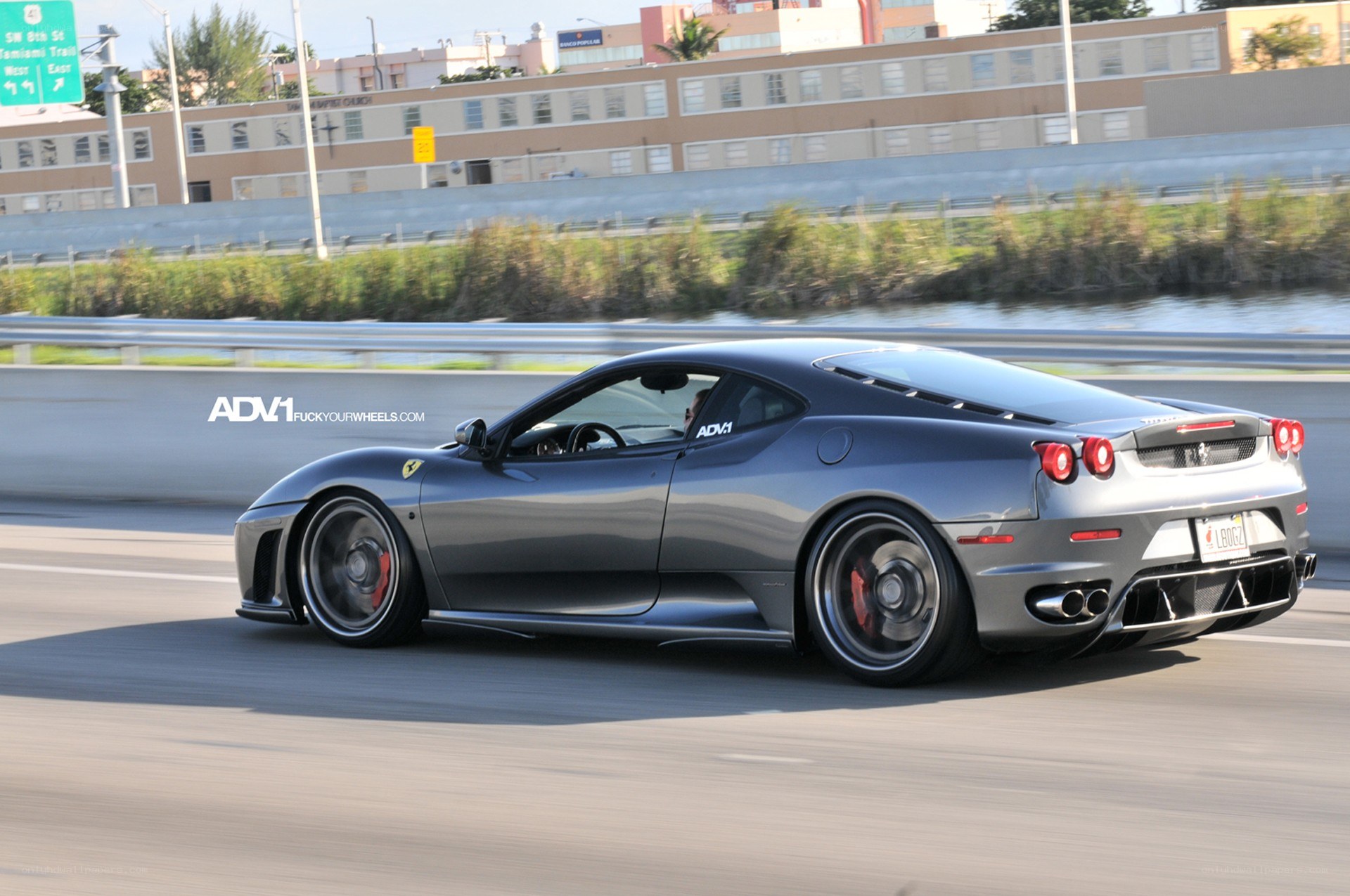 gray ferrari driving on highway