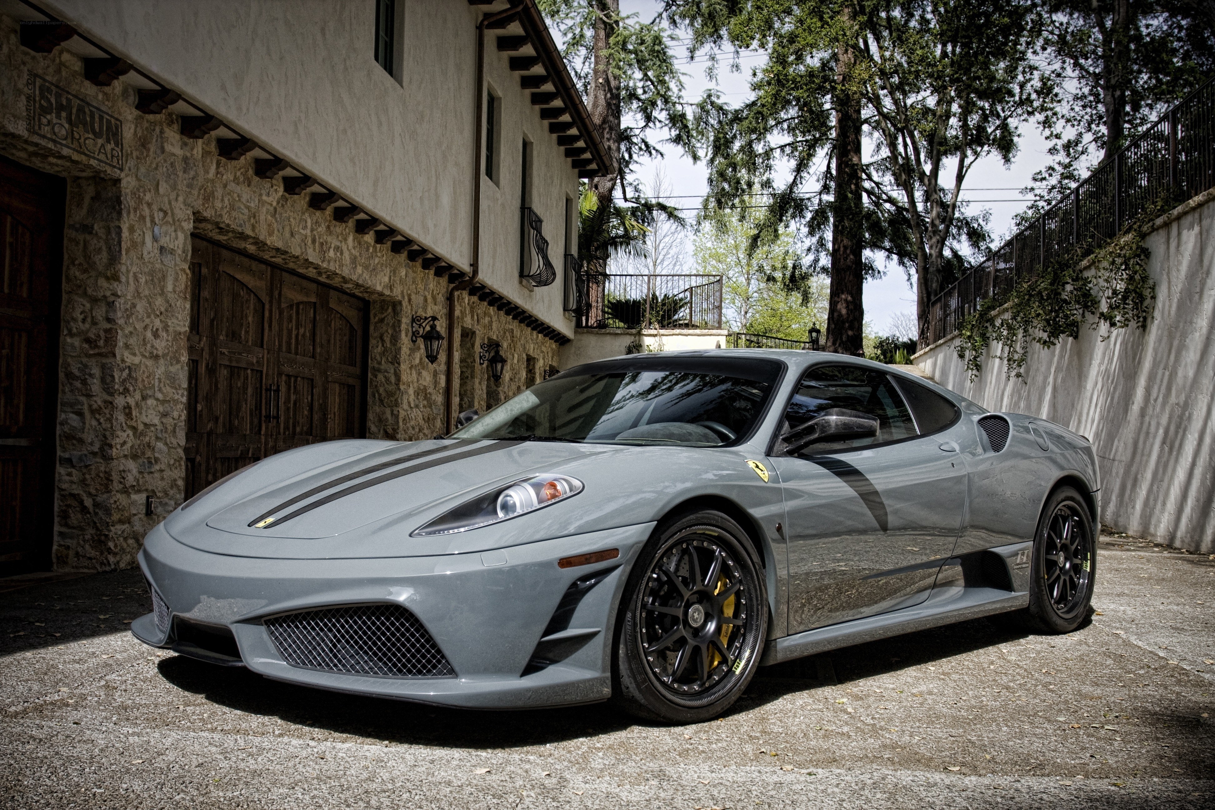 Gray Ferrari in driveway