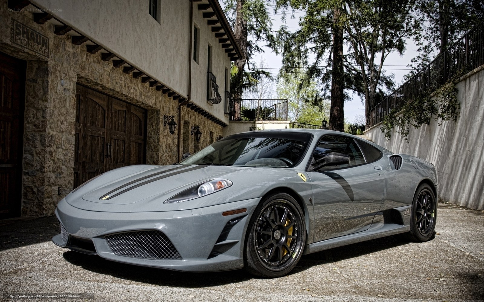 Gray Ferrari in driveway