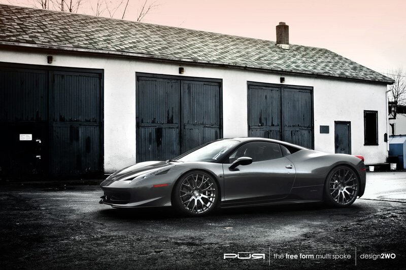 gray ferrari in front of garage
