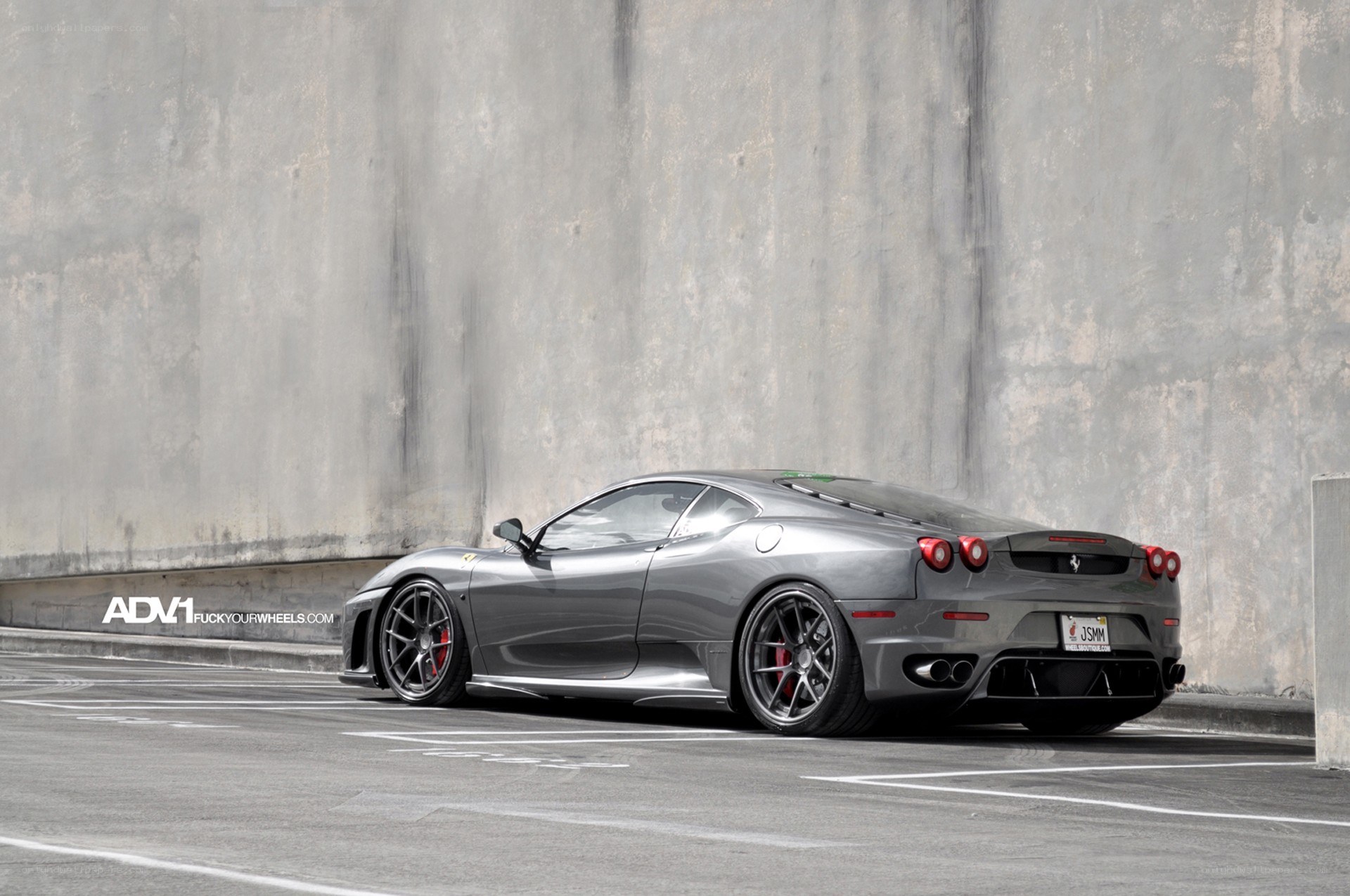 Gray Ferrari in parking garage