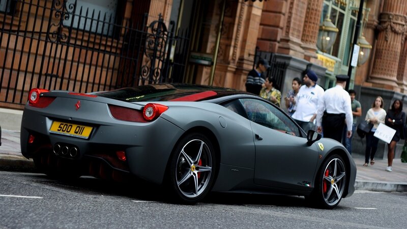 Gray Ferrari on city street