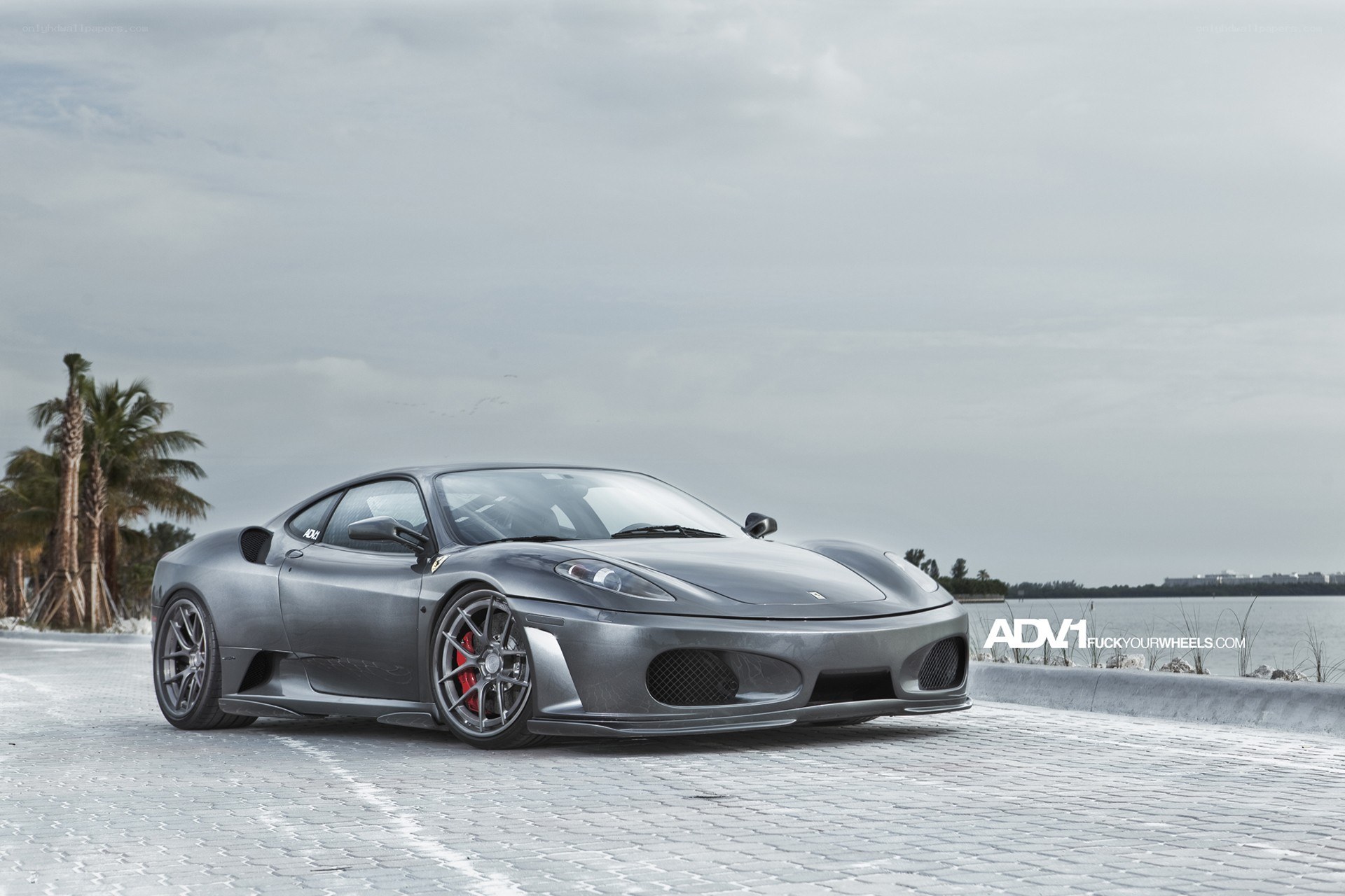 gray ferrari on cobblestone