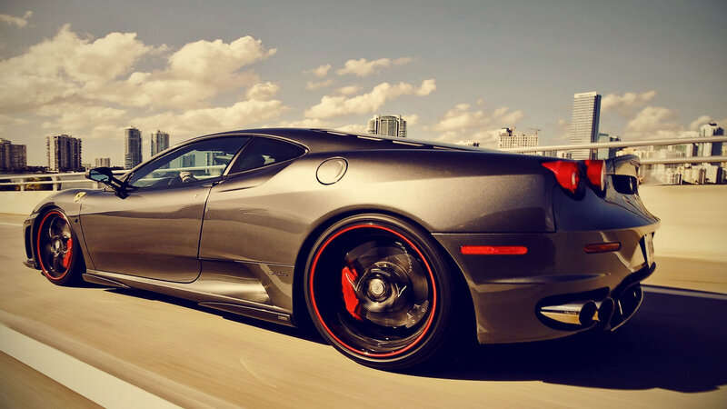 gray ferrari sports car on bridge