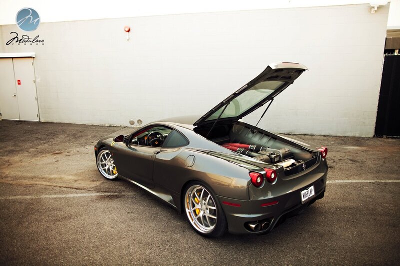 Gray Ferrari with open engine bay